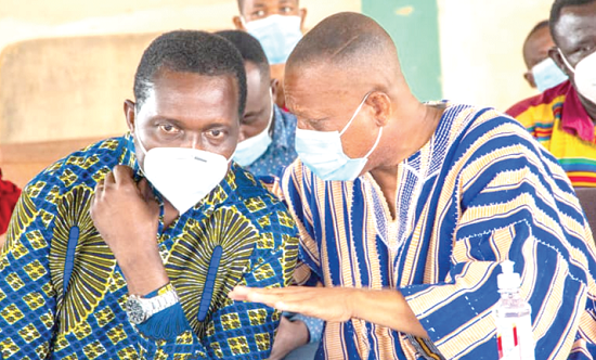  Dr Yaw Osei Adutwum (left) having a chat with Mr Aikens Addai-Poku, Bosomtwe Constituency Chairman of the NPP, during the delegates conference 