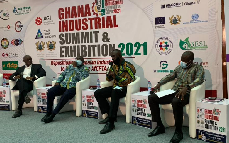 • Director of NPI, Dr Seth Kofi Debrah (2nd right), making his submission during a question and answer session at the summit