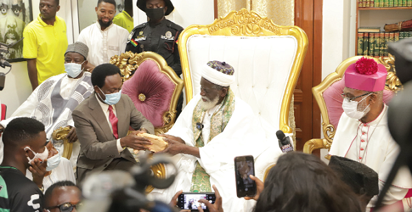Sheikh Usman Nuhu Sharubutu (middle), the National Chief Imam, making a presentation of GH¢50,000 to Apostle Prof. Opoku Onyinah (left), the Chairman of the Board of Trustees, National Cathedral of Ghana, during the meeting. Looking on is Archbishop Charles Palmer-Buckle (right), Vice-Chairman, Board of Trustees, National Cathedral of Ghana. Picture: EDNA SALVO-KOTEY