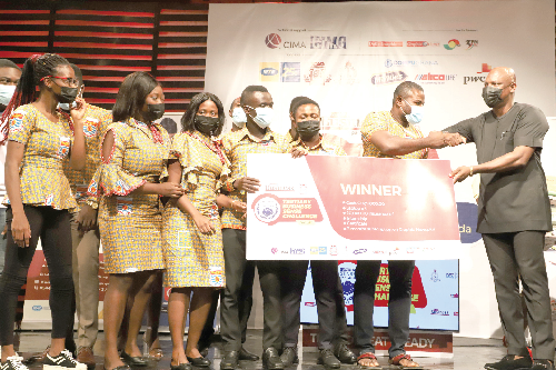 Mr Ato Afful (right), Managing Director of the Graphic Communications Group Limited,  presenting the overall prize to Dr Edward Amarteifio,  a lecturer of the UCC. Picture: GABRIEL AHIABOR