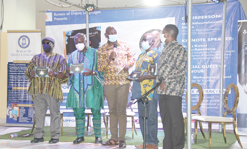  Mr John Agbeko (middle), Director, Ministry of Tourism, Arts and Culture, leading the launch of the book. With him are Prof. Lade Wosornu (2nd left), the author; Mr Abdourahamane Diallo (right), the UNESCO REP to Ghana; Mr William Boateng (2nd right), Director of Bureau of Ghana Languages, and Nana Kwasi Gyan-Apenteng (left), Communications Consultant. Picture: ALBERTA MORTTY