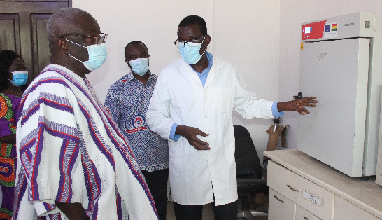 • Mr. Nelson Amey (right), Head of Analytical Sciences, CSIR, explaining the operation of an equipment to Dr Kwaku Afriyie (left), Minister in charge of the sector during the tour. Picture: Patrick Dickson