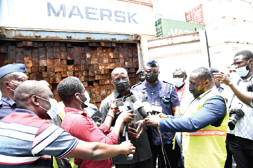 Mr Samuel Jinapor, Minister of Lands and Natural Resources briefing newsmen at Overseas Commercial Ghana Limited on the smuggled Rosewood 