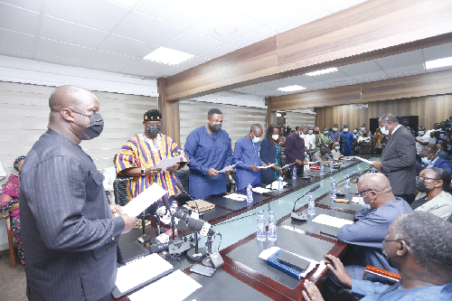 Mr Samuel Abu Jinapor (left), Minister of Lands and Natural Resource, swearing in members of the board. Picture: NII MARTEY M. BOTCHWAY
