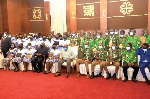 President Akufo-Addo (middle) and Vice-President Dr Mahumudu Bawumia (4th left) with some students of Prempeh College and the Methodist Girls High School. Picture: SAMUEL TEI ADANO