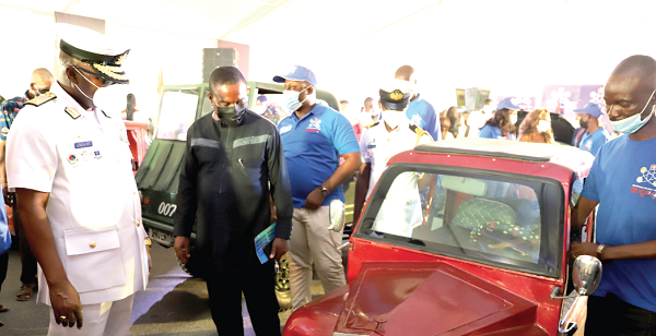 Vice-Admiral Seth Amoama (left), the Chief of the Defence Staff, and Dr Vladimir Antwi Danso (2nd left), Dean of  the Ghana Armed Forces Command and Staff College, examining some of the vehicles displayed at the event