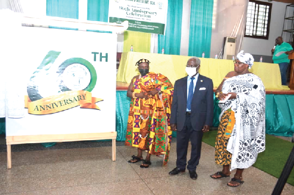 Mr Yaw Osafo-Maafo (middle), Senior Advisor to the President, with Nana Okyere Boamah II (left), Ekuonahene of the Akyem Kotoku Traditional Area, and Nana Banie Adu Ampomaa (right), Ankobiahene, Akyem Asuosu, admiring the 60th anniversary logo after the unveiling. Picture: Benedict Obuobi