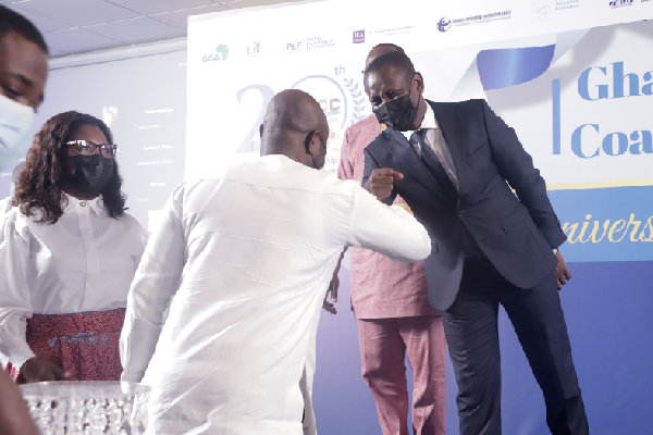 Mr Alfred Tuah-Yeboah (right), Deputy Attorney-General, exchanging pleasantries with some participants in the forum. Picture: EDNA SALVO-KOTEY