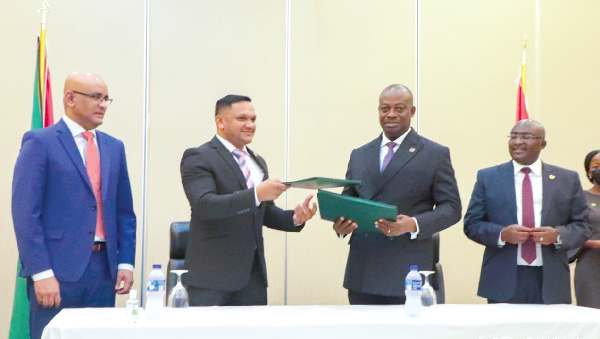 Mr Thomas Mbomba (2nd from right), Deputy Minister of Foreign Affairs and Regional Integration and Mr Hugh Hilton Todd (2nd from left), the Minister of Foreign Affairs and International Cooperation,  exchanging documents after signing  the agreement. Looking on are Dr Mahamudu Bawumia (right), Vice-President of Ghana and Dr Bharrat Jagdeo, Vice-President of Guyana