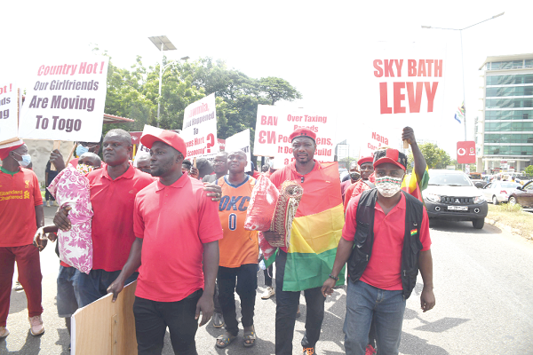 Some of the protestors carrying their placards 