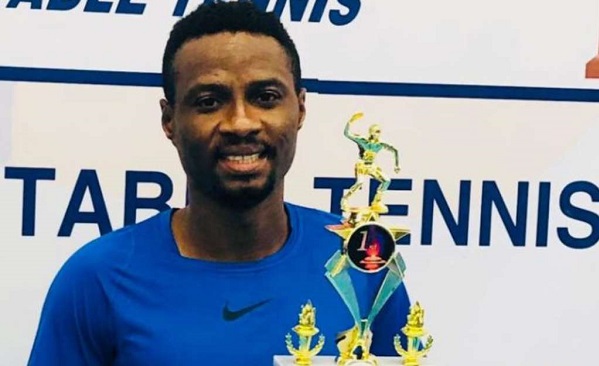 Felix Lartey displaying the trophies he won in the USA