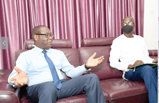  Rev. Dr Ernest Adu-Gyamfi (left), Chairman of the National Peace Council, stressing a point during the interview with Mr Albert Salia