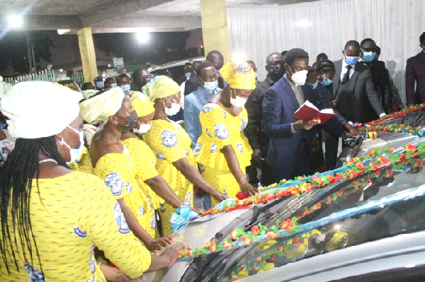 Apostle George Awuku Morklar (arrowed), the Prophetic Director of CAC International, commissioning the cars