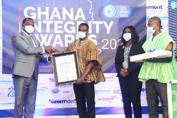 Mr Manasseh Awuni Azure (in smock) was receiving the award for his bravery in exposing corruption