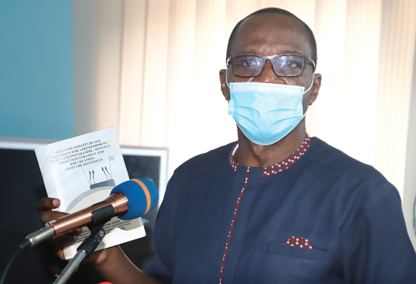  Mr Roland Affail Monney, President of the Ghana Journalists Association, launching the book in Accra.Picture: GABRIEL AHIABOR