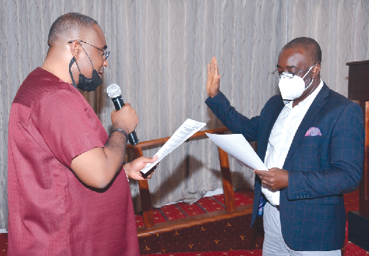 Mr. Magnus Lincoln Quarshie (right), 5th President of GCEA, being sworn into office by Mr. Albert Viala des Bordes, immediate past President of GCEA