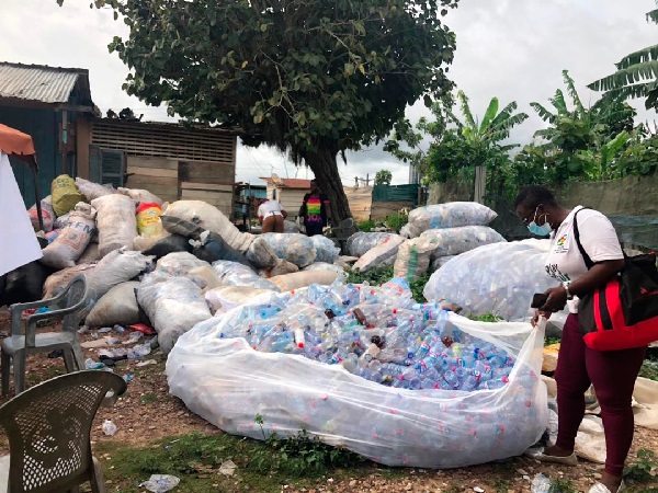 Ms Louise Kabobah of GRIPE preparing used plastics bottles for transportation to the recycling plant.