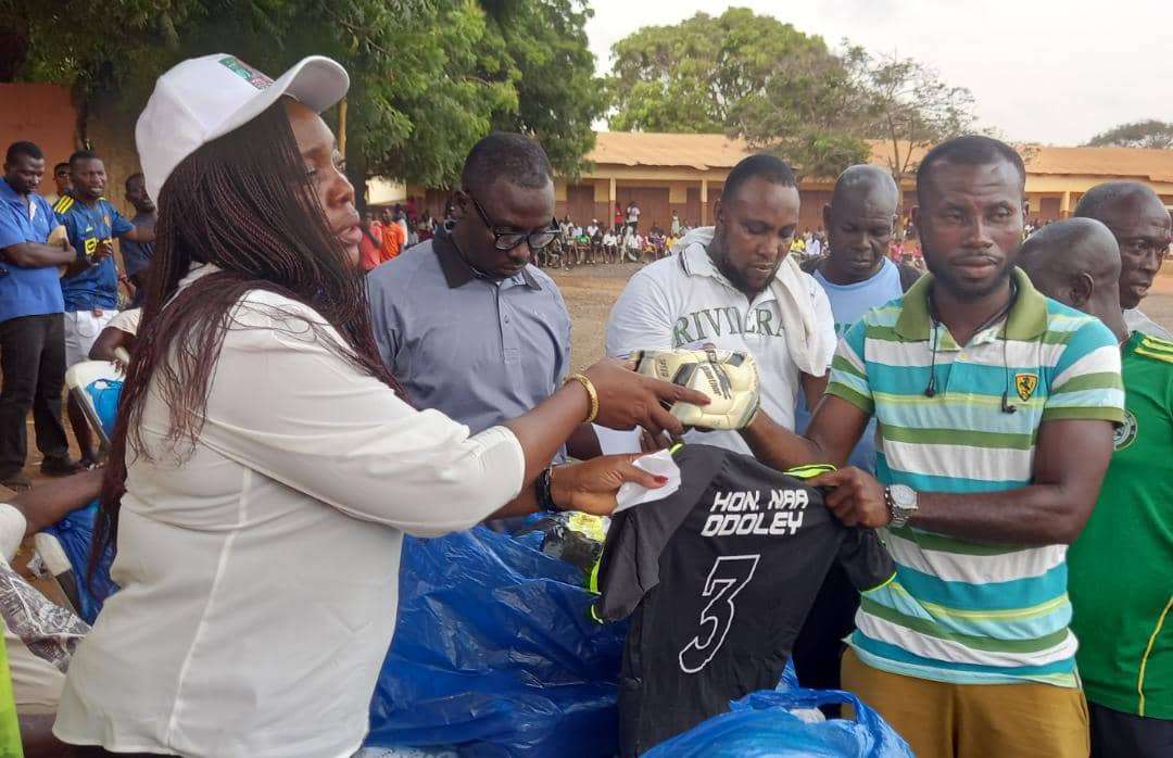 Madam Rita Odoley Sowah presenting some jerseys to the participating teams