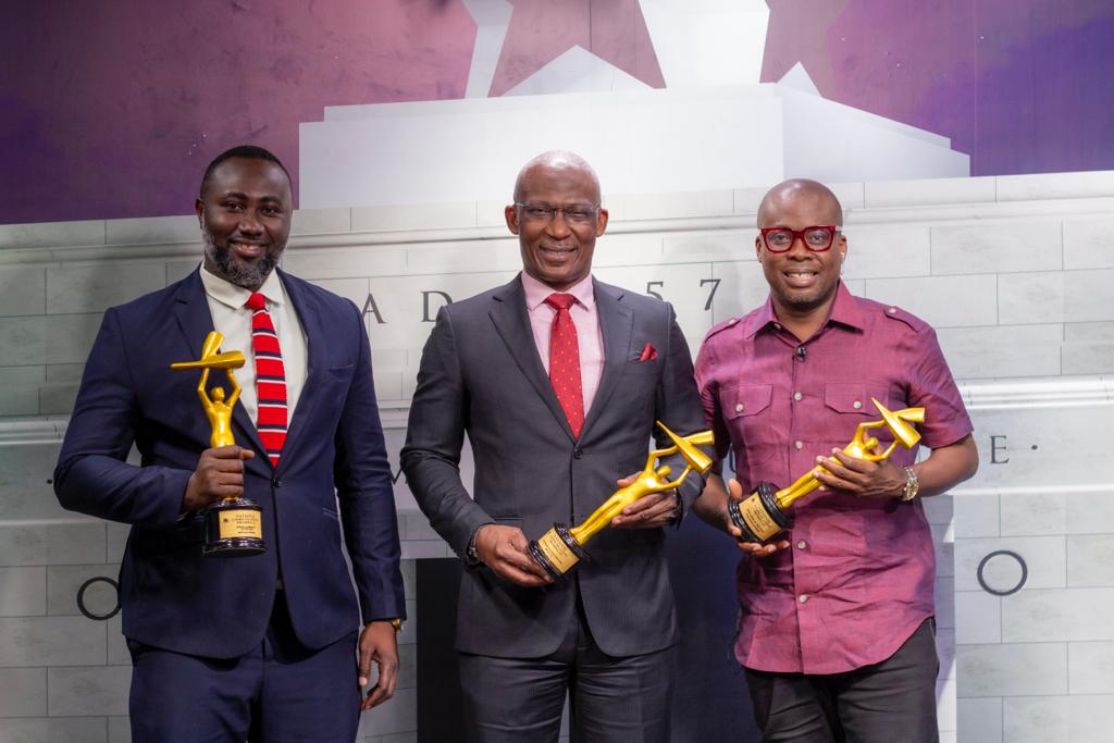 Mr Kayode Akintemi (middle),the Managing Director of the Metro TV, Mr Paul Adom Otchere (right) Host of  Good Evening Ghana and Mr Michael Oduro (left) of Metro Sports displaying some their awards  