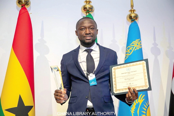 Mr Hayford Siaw, Executive Director of the GhLA, displaying the award