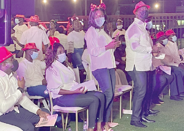  Dr Fred Safo-Kantanka (4th from right) clapping his hands during the carols service 