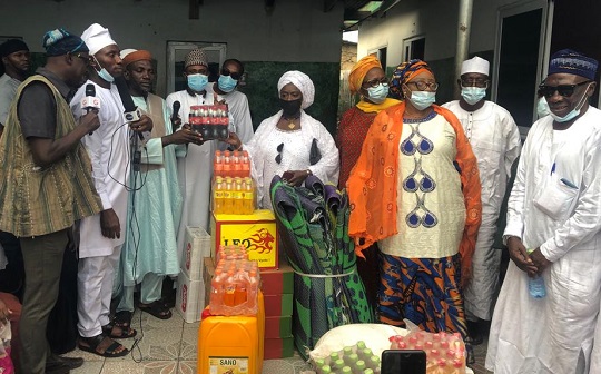  Hajia Rissi Ali Vanderpuye (fifth right) presenting the items to the leaders of the Rahman Mosque