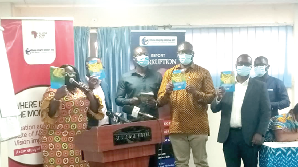 Mrs Linda Ofori-Kwafo (left), Executive Director of the Ghana Integrity Initiative, and some officials of the organisation launching the report 