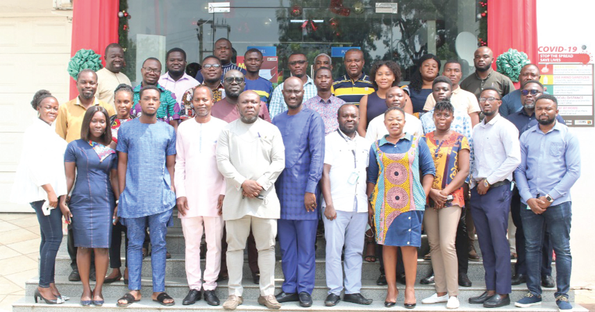 Mr Clyde Adjei (4th from left), Deputy Managing Director, Ghana Link Network Services Limited; Mr Elvis Darko (5th from left), Team Lead, PJN, and members of the association