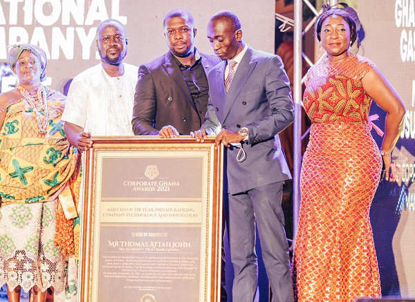 The Head of Corporate Communications of Ghana National Gas Company (GNGC), Ernest Owusu-Bempah (2nd right) receiving his award