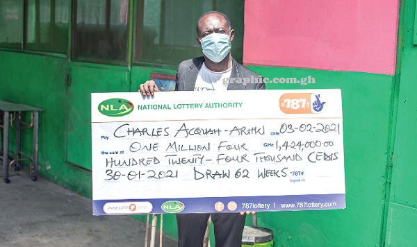 Mr Charles Acquaah-Arhin with the dummy cheque