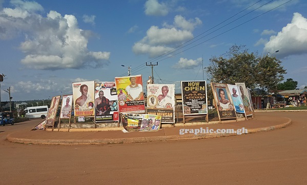 Billboards take over a roundabout in Tepa in the Ashanti Region making it difficult for motorists to see vehicles on other side. Picture: DOUGLAS ANANE-FRIMPONG