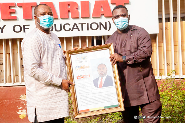 Mr Isaac Hyde (right) presenting the citation to Dr Opoku Prempeh