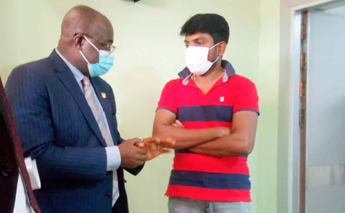 Dr Philip Bannor (left) interacting with a representative of the China Recovery Clinic