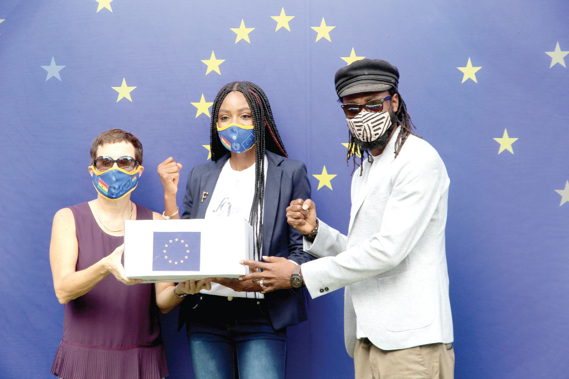Ms Diana Acconcia (left), presenting some face masks to Mr Richmond Kennedy Quarcoo (right), Executive Director of Plastic Punch. Looking on is Ms Victoria Michaels (middle), Chief Executive Officer of Fashion Connect Africa. Picture: ESTHER ADJEI