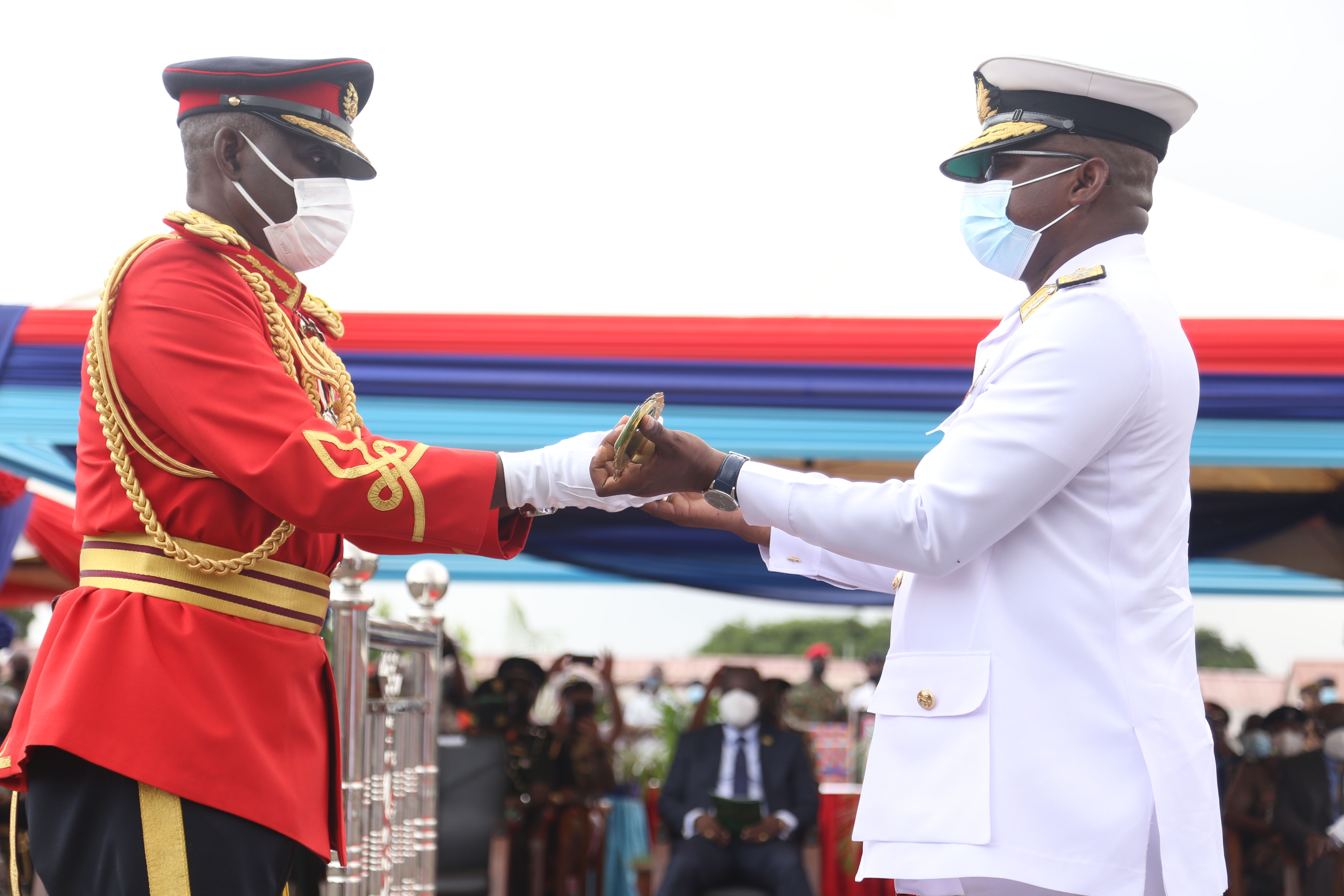 Lt. Gen. Obed Boamah Akwa (left), the outgoing Chief of Defence Staff (CDS), handing over the staff of authority to Rear Admiral Seth Amoama, the Acting CDS 