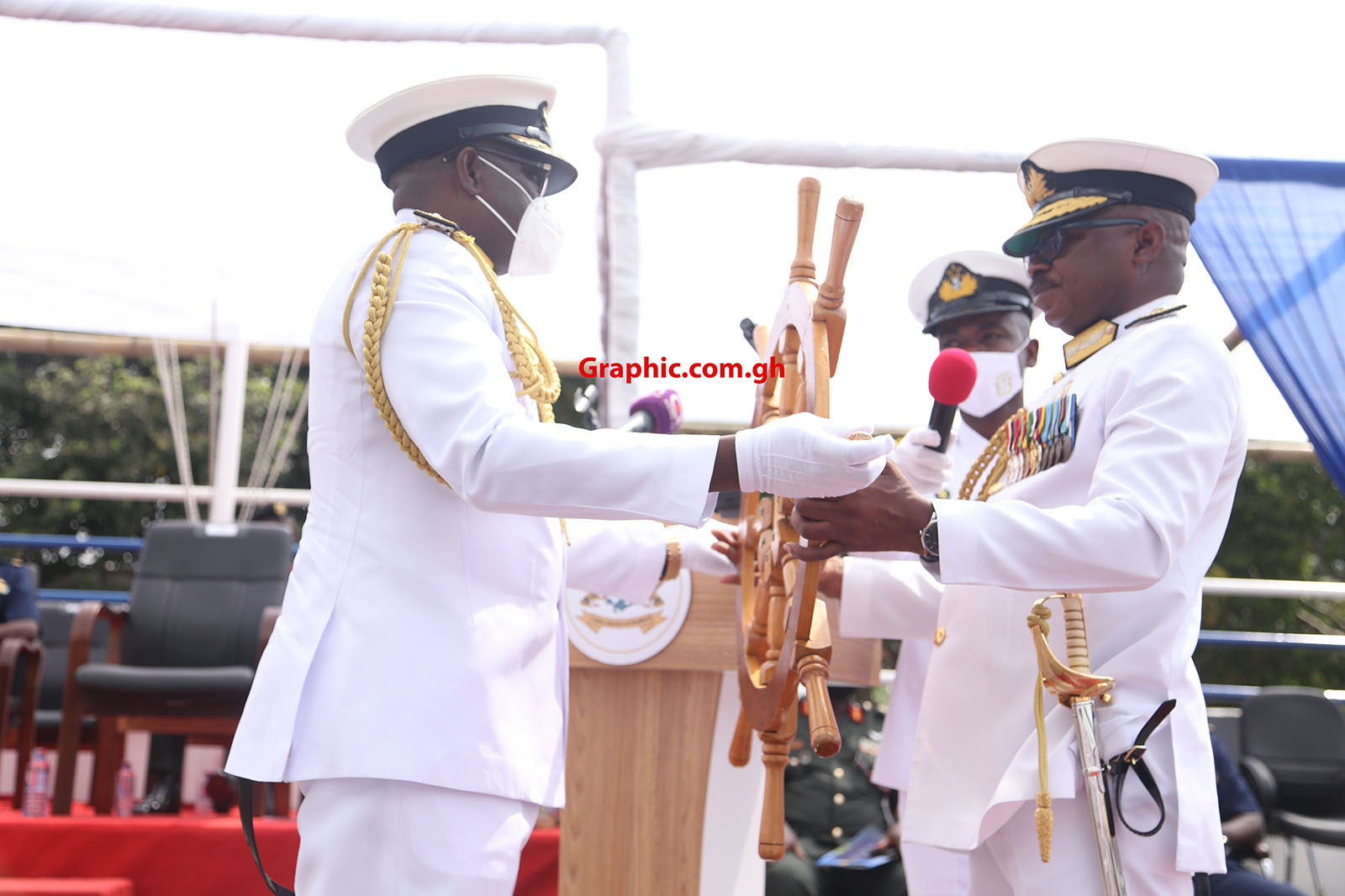 Rear Admiral Seth Amoama (right), the acting Chief of Defence Staff, handing over the wheel of command to Rear Admiral Issah Yakubu
