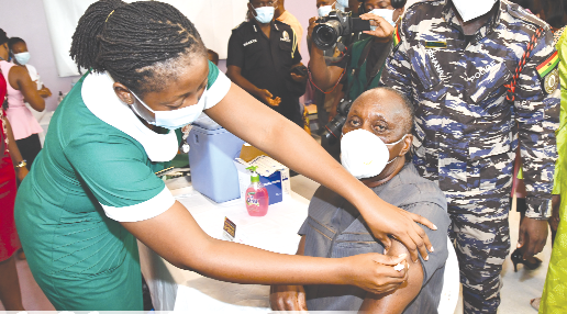 Nana Otuo Siriboe II, Chairman of the Council of State, taking the first dose of the vaccine.  Picture: EBOW HANSON