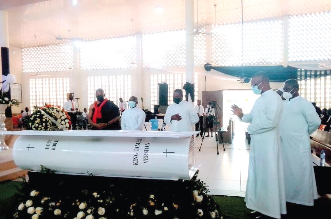 Worshippers and family members pay their last respects to the late Rev. Seth Agidi