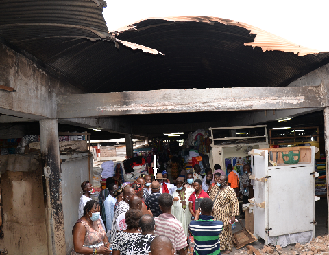 Mr Briamah Isaac (arrowed), Patron of the Market Women Association, briefing the delegation on the extent of damage. Picture: Alberta Mortty