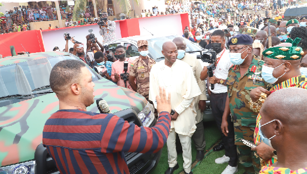 Mr Kwadwo Safo Jnr.(left) explaining a point about a vehicle to Brigadier General Michael Amoah-Ayisi (3rd right), Chief Staff Officer at the Army Headquarters of the Ghana Armed Forces and other officials at the event­ in Accra. Picture: GABRIEL AHIABOR