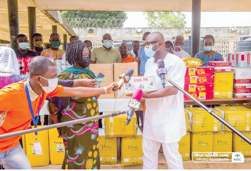 Prof. Opoku-Agyemang presenting the items to Dr Baning