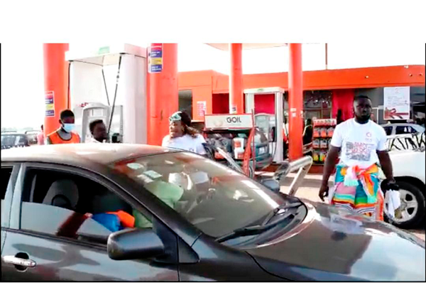 A driver receiving service at a Goil fuel filling station