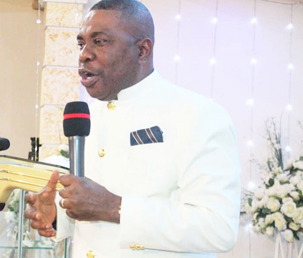 Apostle George Yeboah (right) leading the congregation in prayer