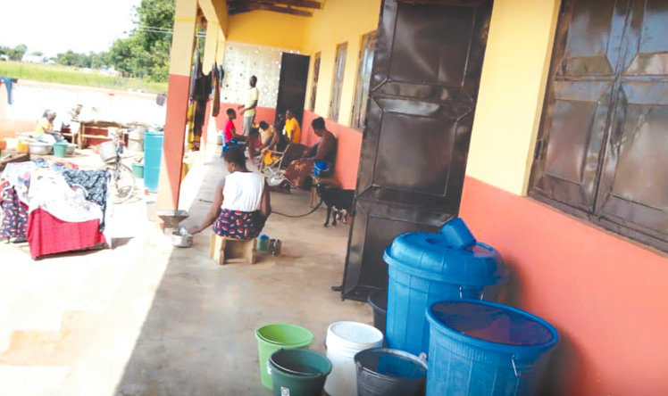 Displaced flood victims with their belongings