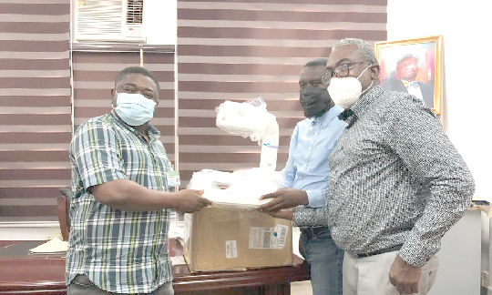 Mr. Mustapha Abari (right), the West Africa Sales Manager of Sysmex, presenting the vein finder to Dr. Tambil (left), Medical Director of the hospital.