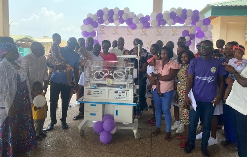 Kwami Sefa Kayi and his partners presenting the third infant incubators to the authorities of the Ho Teaching Hospital