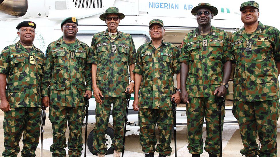 President Buhari (third from left) said he had accepted the military chiefs' "immediate resignation"