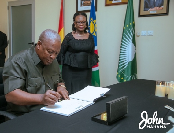 Former President Mahama signing the book of condolence 