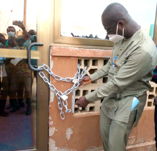  Mr Agyemang Badu, Head of Operations, Health Facilities Regulatory Agency locking the Susan Clinic in Latebiokorshie