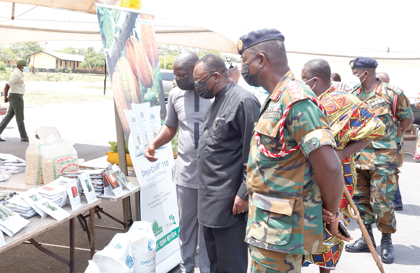 Dr Owusu Afriyie Akoto (2nd left), Minister of Food and Agriculture; Mr Eric Asameni (left), Accra Regional Director of Agriculture and Maj Gen Charles Awity (right), Commandant, Military Academy &amp; Training Schools, inspecting some agricultural products on exhibition. Picture: NII MARTEY M. BOTCHWAY